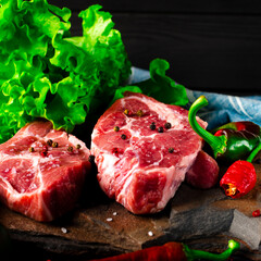 Raw meat beef marble steak with spices and vegetables