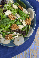 Homemade lettuce assortment salad with blue cheese, walnuts and pear