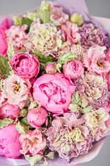 Beautiful bouquet of mixed flowers in woman hand. Floral shop concept . Handsome fresh bouquet. Flowers delivery.