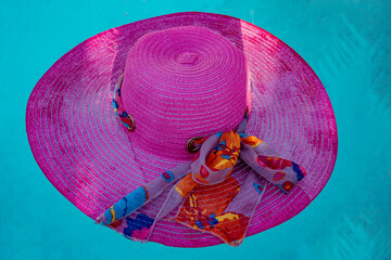 Pink hat in the water, wet hat