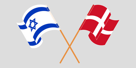 Crossed and waving flags of Israel and Denmark