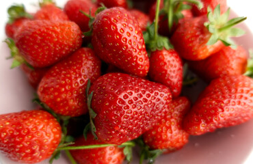 Closeup summer fresh red strawberries. Natural ripe berries. Vegetarian and healthy eating concept. 