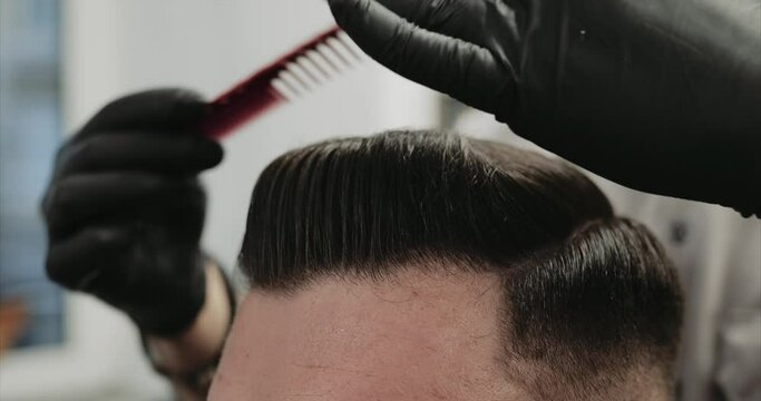 Classic hair styling with paste and wax. Vintage haircut.