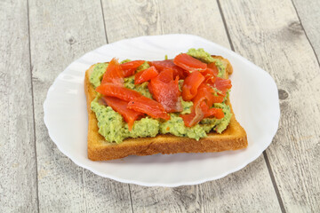 Toast with guacamole and salmon