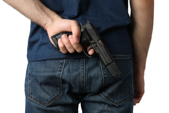 A man pulls a gun from behind, isolated on white background