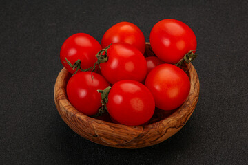 Ripe juicy cherry tomato in the bowl