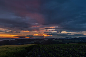 Obraz premium Sunset in hot summer rainy evening near Roprachtice village