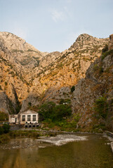 Fototapeta na wymiar Old hydroelectric power plant is located in a mountain gorge