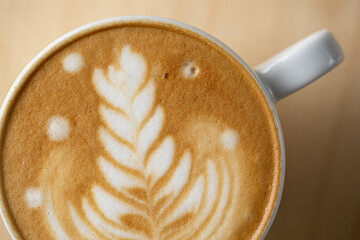 Macro shot of latte art in a white cup