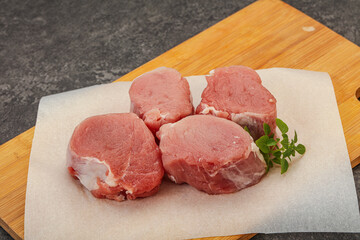 Raw pork medallion served rosemary