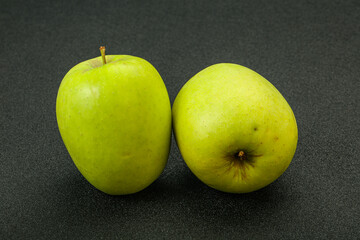 Two ripe green sweet apples
