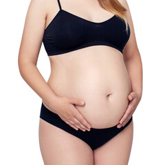 Pregnant woman touching her big belly in black lingerie. Motherhood, pregnancy concept.