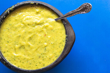 guacamole in a black cup