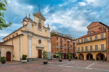 Fototapeta premium Church and historic house on small town square in Alba, Italy.