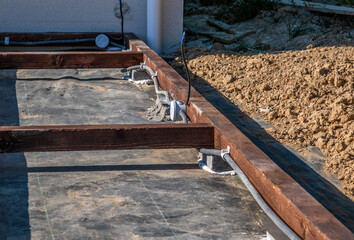 wooden frame on bricks for laying the terrace