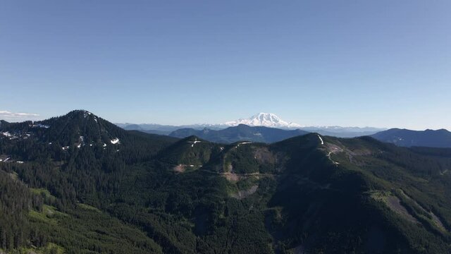 Washington Cascade Mountains Aerial with Mt Rainier and Spring Blue Sky