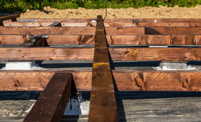 Fototapeta premium wooden frame on bricks for laying the terrace