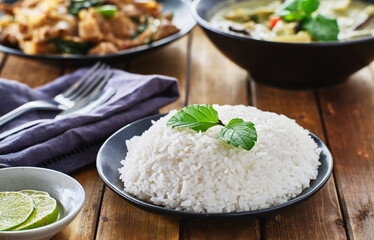 thai style jasmine rice on plate on wooden table top