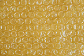 Packaging with air bubbles on a yellow background. Bubble wrap texture, packaging, air bubble film....