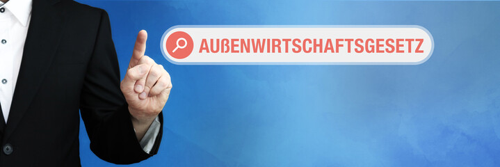 Außenwirtschaftsgesetz (AWG). Anwalt zeigt mit Finger auf Suchfeld im Internet. Wort steht in der...
