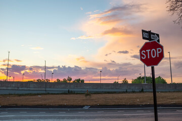 Sop sign on the road during sunset 