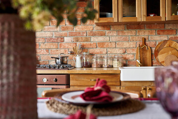 Serving for dinner on kitchen table. Warm kitchen background interior.