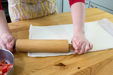 Preparing puff pastry.