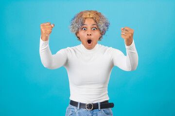 isolated euphoric afro american girl with expression of success