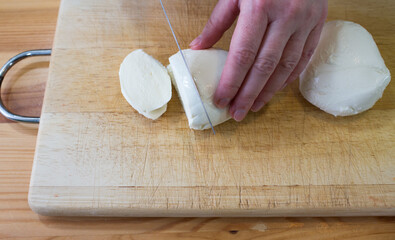 Preparing mozzarella.