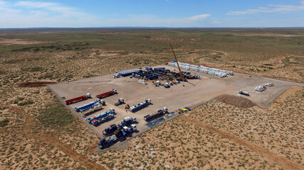 Vaca Muerta, Argentina, December 25, 2015: Extraction of unconventional oil. Battery of pumping trucks for hydraulic fracturing (Fracking).