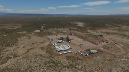 Vaca Muerta, Argentina, December 25, 2015: Extraction of unconventional oil. Battery of pumping trucks for hydraulic fracturing (Fracking).