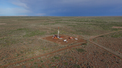 Vaca Muerta, Argentina, December 25, 2016: Extraction of unconventional oil. Battery of pumping trucks for hydraulic fracturing (Fracking).