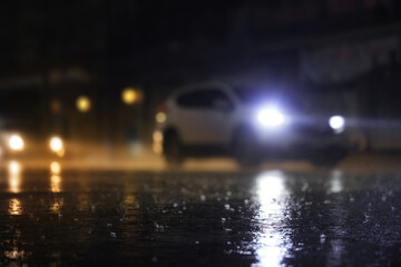 Night scene of hard rain fall in the city.Selective focus and shallow depth of field composition.