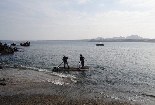 Squid fishing rafts (balsas) between Foca Island and Yacila, near Paita, Peru