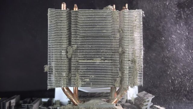 Dust pollution. Cleaning the processor radiator sink from dust. Antistatic brush.4k.