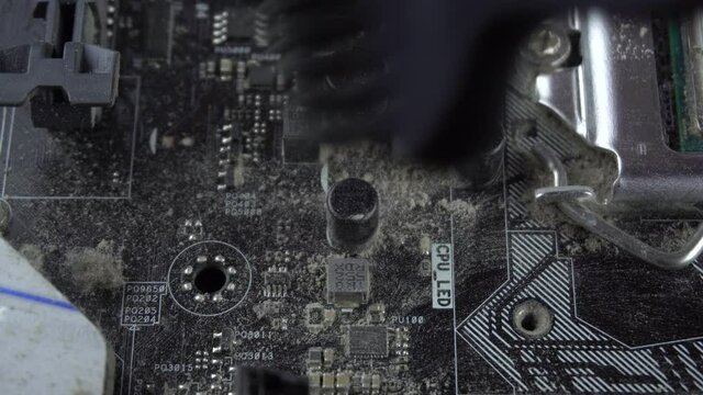 Dust pollution. Cleaning the motherboard from dust. Antistatic brush. 4k.