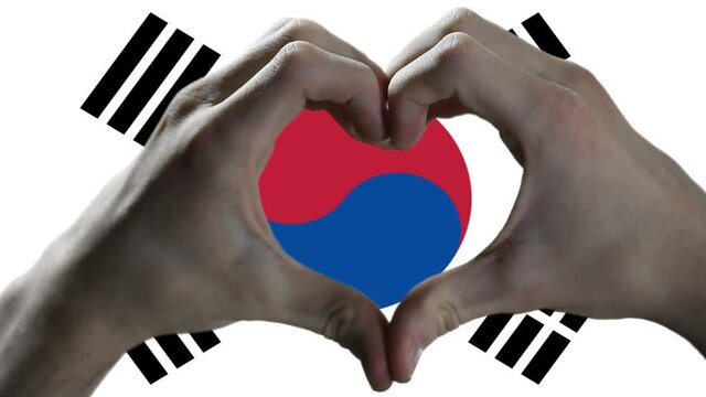 Hands showing Heart Sign over South Korea Flag.