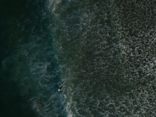 Aerial photo of waves breaking near a rural surf beach, New Zealand. 