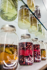 jars of pickled vegetables on display in a restaurant