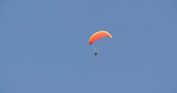 Paraglider in the sky at the Berchtesgaden National Park, Germany.