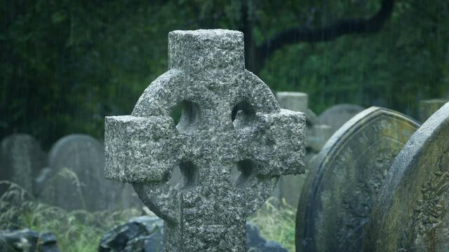 Celtic Style Cross In The Rain In Cemetery