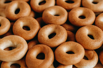 Drying or mini round bagels oas a background image. Top view. Copy, empty space for text