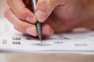 close up of hand drawing on paper with a mechanical pencil
