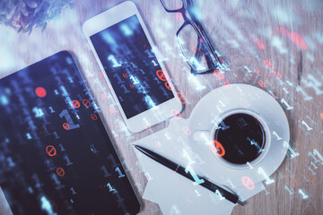 Double exposure of technology theme drawing over work table desktop. Top view. Global data analysis concept.