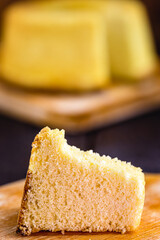 slice of Brazilian corn cake made with a type of corn flour (Fuba). Traditional homemade cake from Brazil.