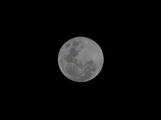gray full moon, observed at night in the southern hemisphere.