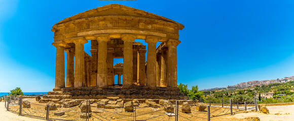 A close up panoramic view of the Temple of Concordia in the ancient Sicilian city of Agrigento in summer