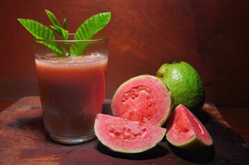 Guava juice isolated on wooden background