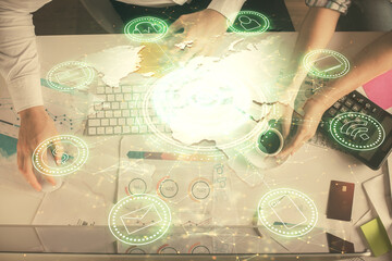 Double exposure of man and woman working together and social network theme hologram drawing. Computer background. connecting concept. Top View.