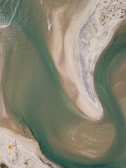 Aerial photo of waves breaking near a rural surf beach, New Zealand. 